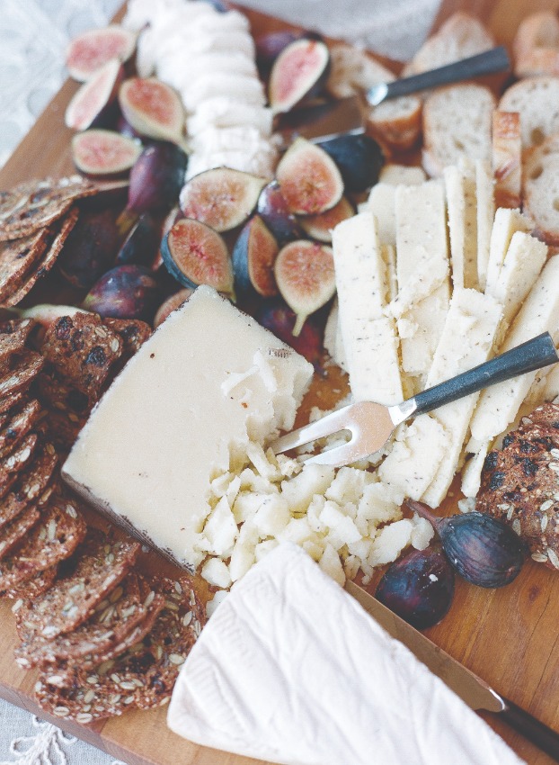 charcuterie with cheeses, crackers, and figs