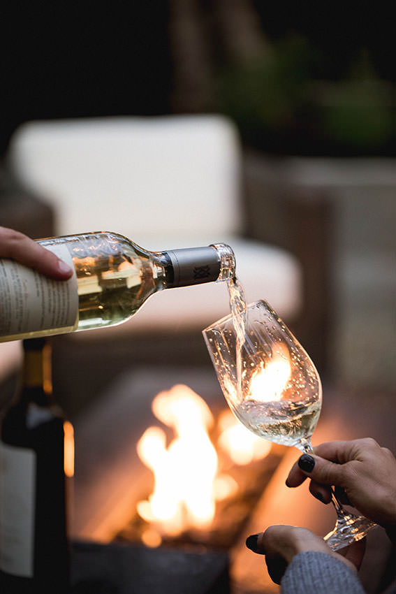 white wine being poured into a wine glass